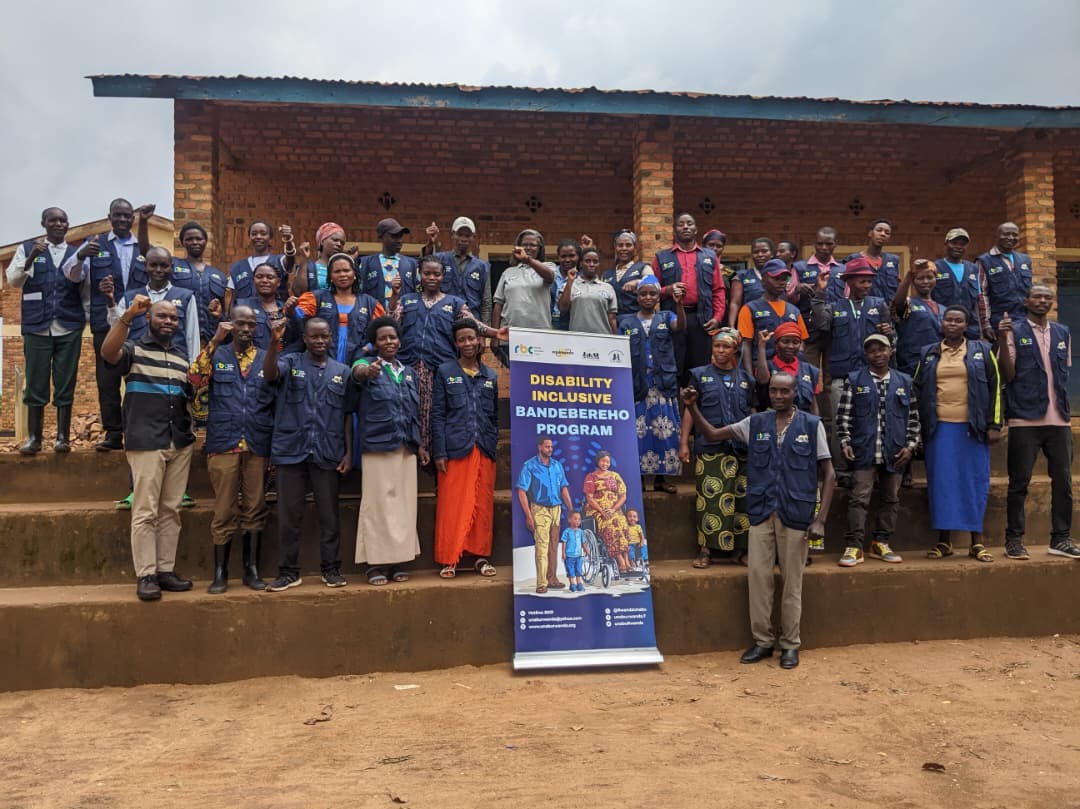 ngo-illustration-Artboard 5 Photo: Community Health Workers from Muhondo Health Center all in dark blue jackets with BANDEBEREHO label